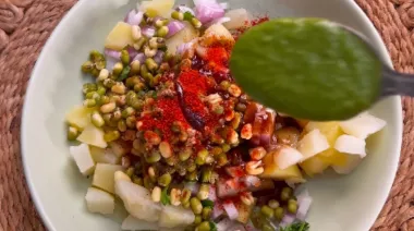 Crispy fried chaat cones filled with potato-moong stuffing, chutneys, curd and sev